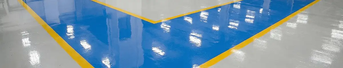 A factory floor professionally covered and marked with epoxy flooring in Tucson, AZ