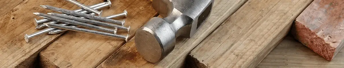 Hammer and nails on hardwood flooring boards in Tucson, AZ